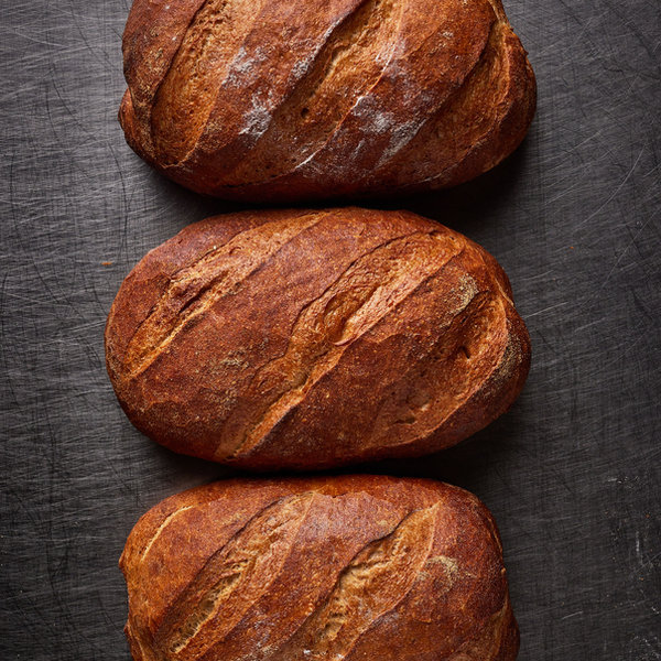 Three freshly baked sourdough loaves